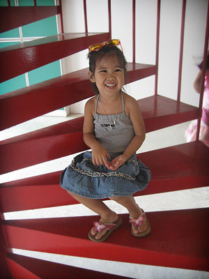 Cleo on a red stair