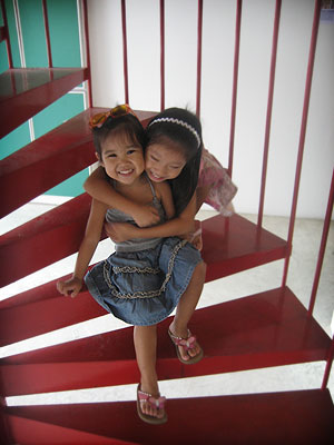 The girls on red stair