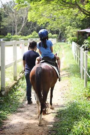 Cli� riding a pony