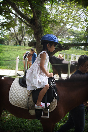 Cleo riding a pony