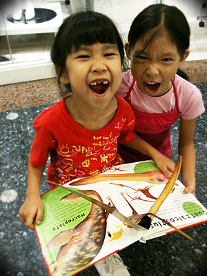 Cleo with her pop-out dinosaur book Cleo with her pop-out dinosaur book